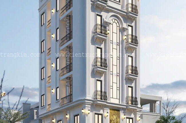 Mặt tiền tòa nhà cao tầng màu trắng tinh tế, kiến trúc châu Âu hiện đại.