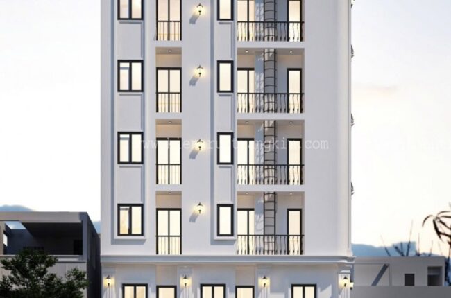 Mặt tiền tòa nhà nhiều tầng, kiến trúc hiện đại, tông màu trắng chủ đạo.