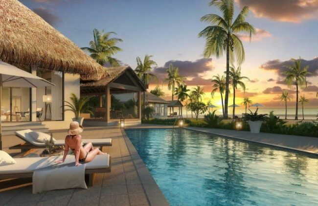 Khu nghỉ dưỡng sang trọng bên bờ biển lúc hoàng hôn tĩnh lặng.